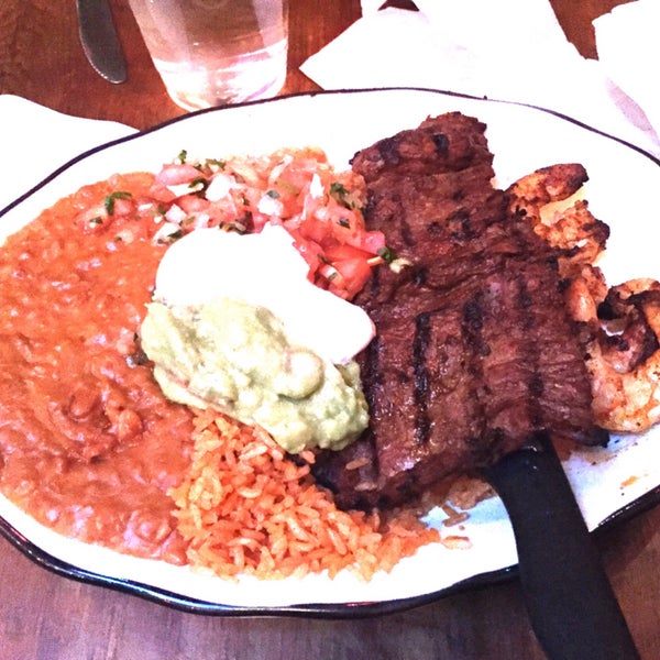 rosarito surf and turf - skirt steak, grilled shrimp, beans, rice, guacamole, pico de gallo, and sour cream