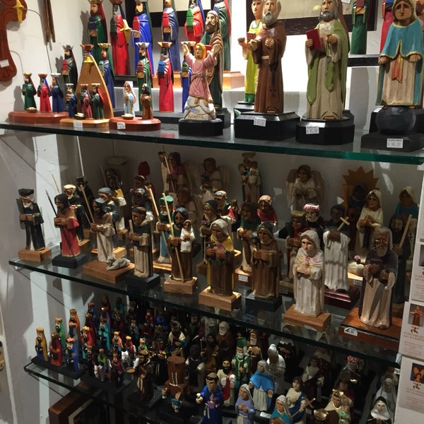 santos are traditional puerto rican folk art - vividly painted wooden sculptures depicting saints and other religious figures