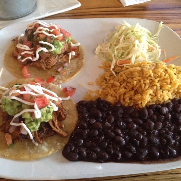 Lunch special: choice of two tacos + rice + beans + house slaw for $10