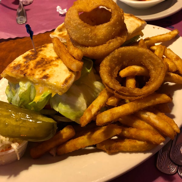 cheeseburger panini deluxe served with french fries and onion rings