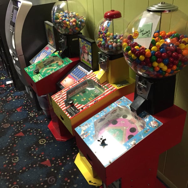 atm near the entrance with the gumball and fortune telling machines