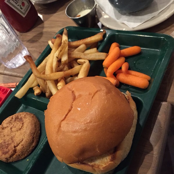 kids burger with french fries, carrot sticks, and a cookie