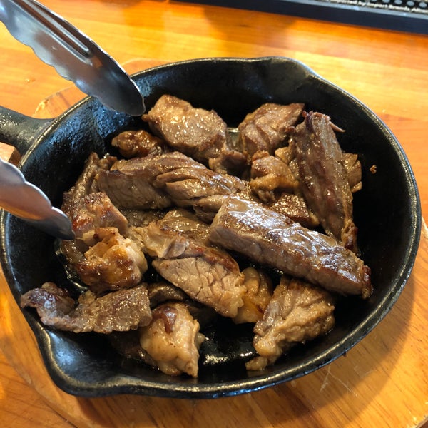 pipikaula served in cast iron. turn them before eating to sear the top.