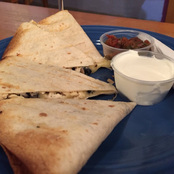 chicken bean and cheese quesadilla served with sour cream and salsa