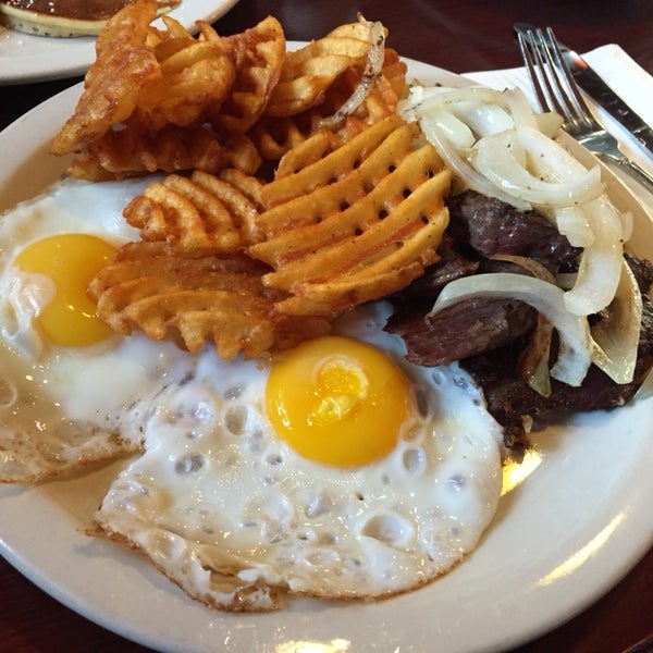 chopped hanger steak and egg breakfast with waffle fries. solid