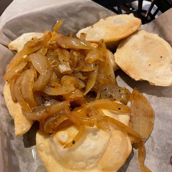 pierogis with fried onions and sour cream