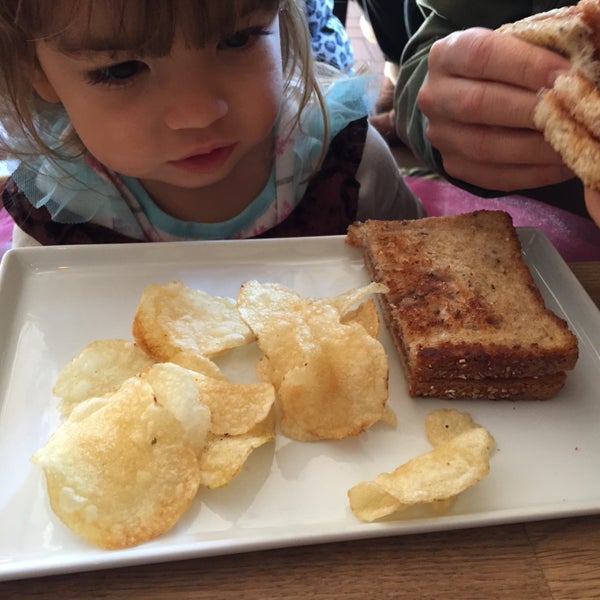 peanut butter and jelly sandwich ("kidwich") on buttery toast served with potato chips
