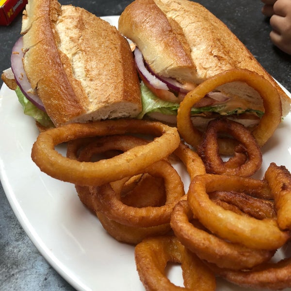 spicy chicken club sandwich with onion rings