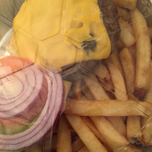beef burger with cheese, lettuce, tomatoes, and onions with french fries, ordered delivery via seamless