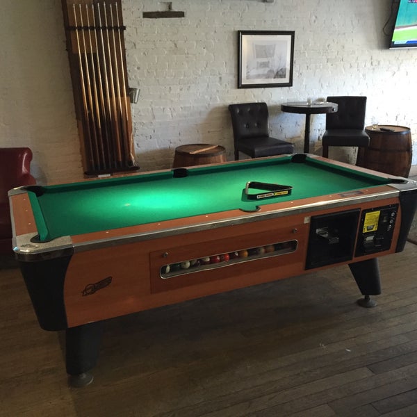 pool table and foosball in the front parlour; head to the back for the bar and backyard seating