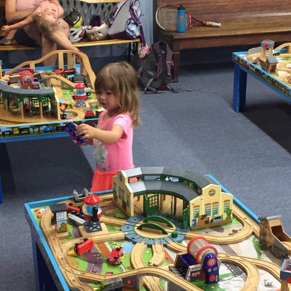 kids love the train tables in back. there are benches along the walls for parents to relax while they play