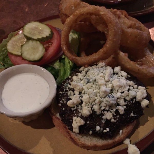 black and blue burger (cajun spice and bleu cheese) with onion ring upgrade