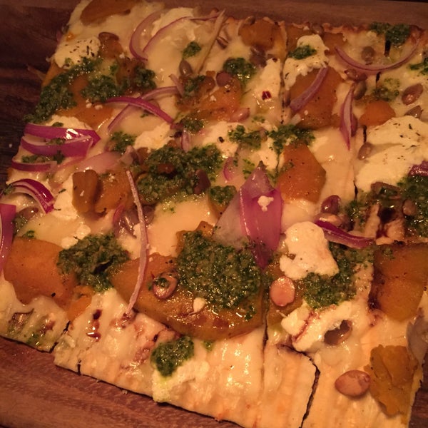 roasted kabocha squash flatbread with cilanto pesto, shaved onion, and pepitas