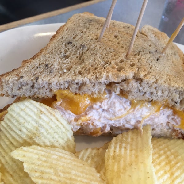 tuna melt with cheddar cheese served with potato chips