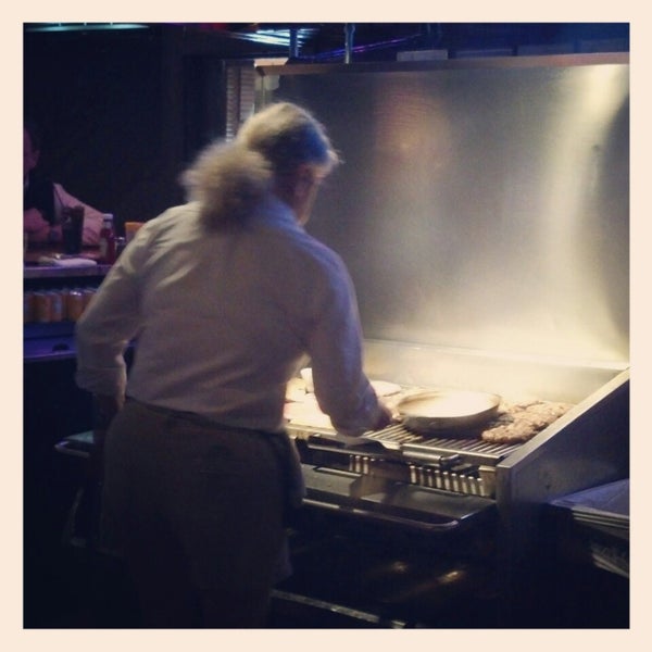 ALWAYS sit at the bar... you can watch them cook your big ol' Burger.