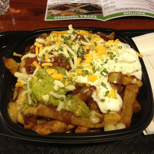 Photo taken at POUTINE Dare To Be Fresh! by Kristine H. on 3/6/2013