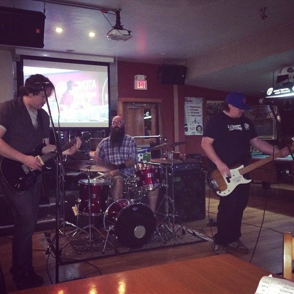 Photo taken at Underdog Bar &amp; Grill by Miles S. on 6/23/2014