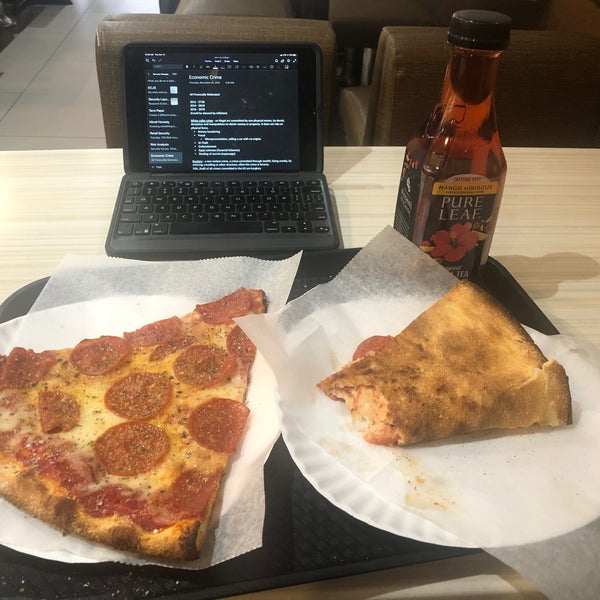 Photo taken at Justino&#39;s Pizzeria by Cyrus B. on 11/14/2019