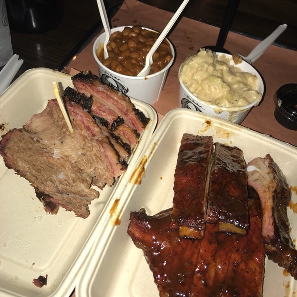 Photo taken at Mighty Quinn&#39;s BBQ by Grace B. on 9/29/2018