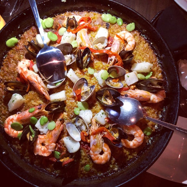 Photo taken at Socarrat Paella Bar by Amy T. on 6/15/2019
