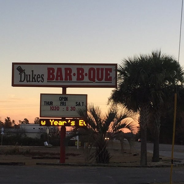 Photo taken at Dukes Bar-B-Que by Anne-Marie K. on 12/26/2014