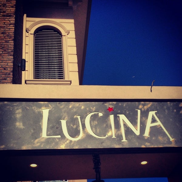 Photo taken at Lucina Cafe by Gamze E. on 12/24/2013