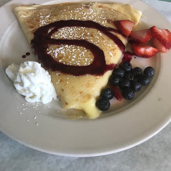 Photo taken at Le Petit Triangle Cafe by Melanie S. on 6/25/2018