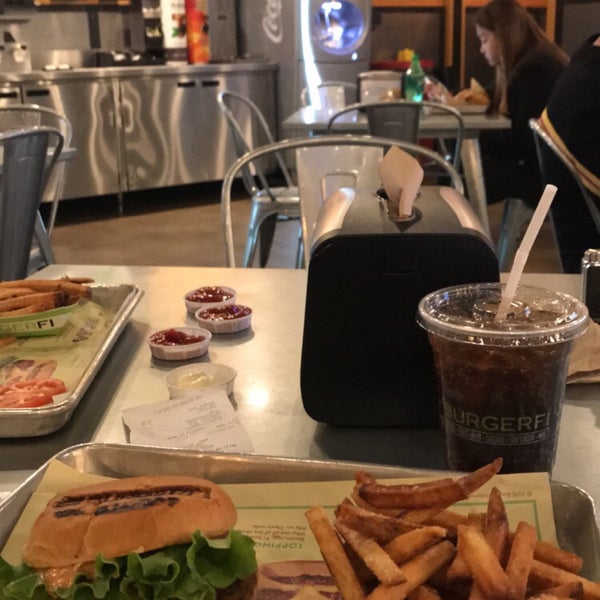 Photo taken at BurgerFi by Adel on 2/3/2019
