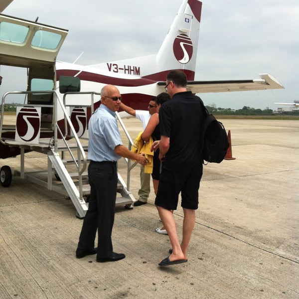 Photo taken at Philip S.W. Goldson International Airport (BZE) by Rebecca C. on 3/25/2013