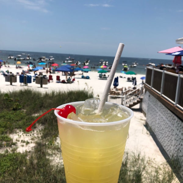 Foto diambil di The Cottage Beach Bar oleh Katie M. pada 7/15/2018