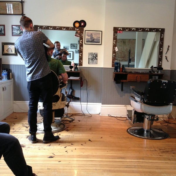 Photo taken at Garrison&#39;s by the park Barbershop by Sol C. on 7/11/2013