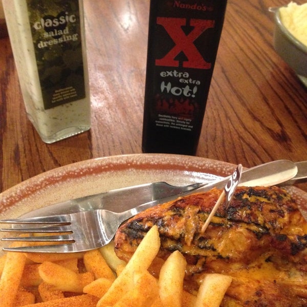 Photo taken at Nando&#39;s by Syd N. on 11/22/2014