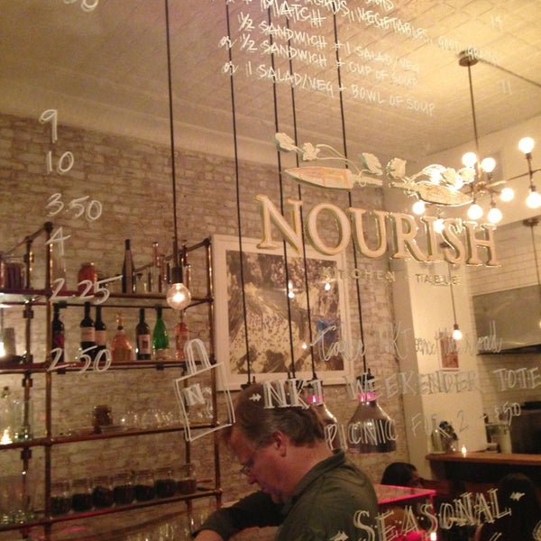 Photo taken at Nourish Kitchen + Table by Chris H. on 9/20/2013