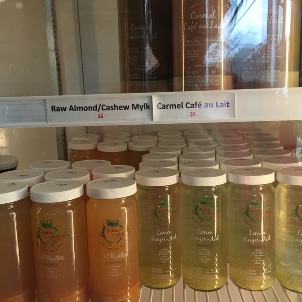 Photo taken at Pure Raw Juice Organic Juice Bar &amp; Cafe by Emily N. on 12/28/2015