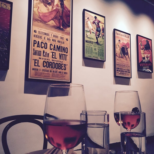 Photo taken at Raval Tapas Bar &amp; Cocktail Lounge by Winnie F. on 6/25/2015