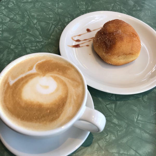 Photo taken at Tin Umbrella Coffee by Amy C. on 4/21/2018