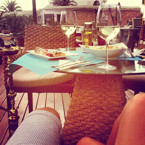 Photo taken at St.Tropez Beach Bar &amp; Restaurant IBIZA by Vladi B. on 8/25/2013