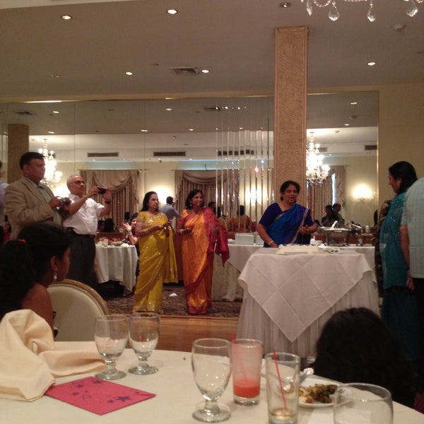 Photo taken at Akbar Indian Restaurant by Holly V. on 7/13/2013
