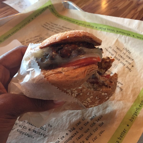 Photo taken at BurgerFi by Ronelle T. on 1/8/2015