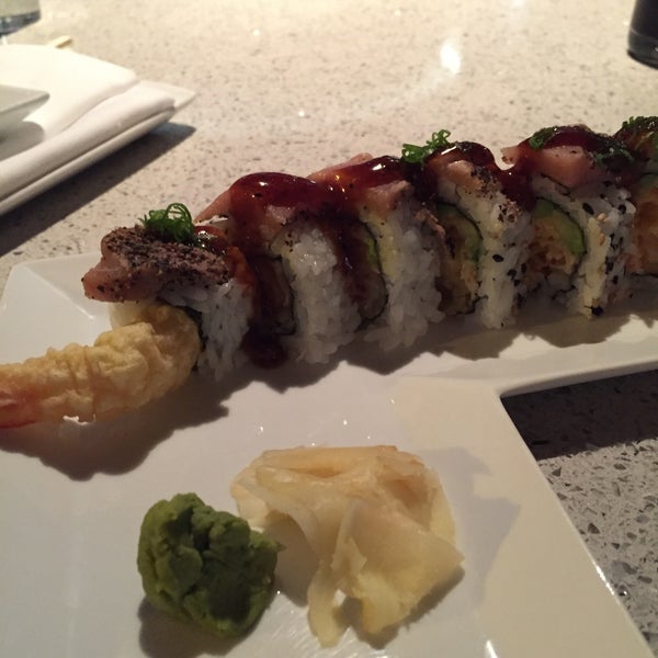 Photo taken at Squid Ink Sushi Bar by Nate R. on 4/18/2015
