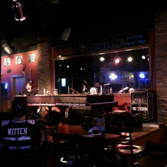 Photo taken at Louie Louie&#39;s Dueling Piano Bar by Erica M. on 12/3/2012