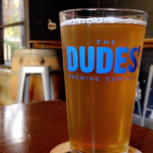 Photo taken at The Dudes&#39; Brewing Company by Carlos S. on 5/18/2018