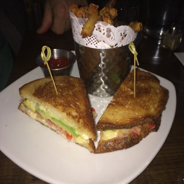 Very good grilled cheese sandwich with camembert, avocado & mango chutney on sourdough bread.
