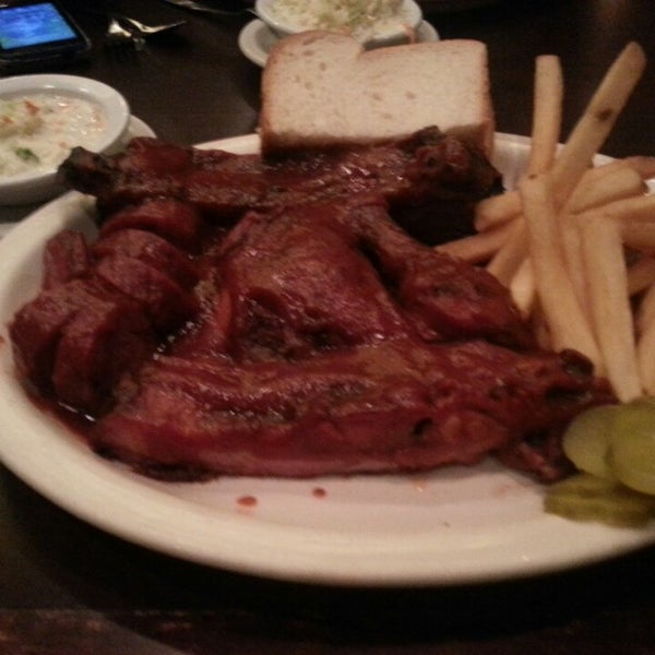 Photo taken at Smokehouse Barbecue by Lauren S. on 4/12/2013