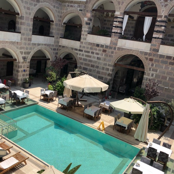 Photo taken at Kanuni Kervansaray Historical Hotel by Öyküm G. on 5/30/2018