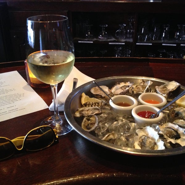 Photo taken at Mayes Oyster House by Dina S. on 6/1/2013