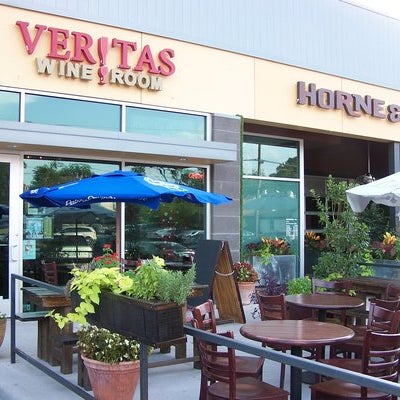 If Veritas Wine Room's rustic, old-world décor and dimly lit, relaxed  atmosphere make the wine bar and retail shop feel more like a pub than  a wine room, it's by design.