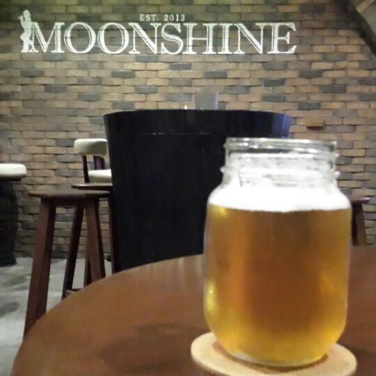 Photo taken at Moonshine Bar by Dino T. on 7/4/2014