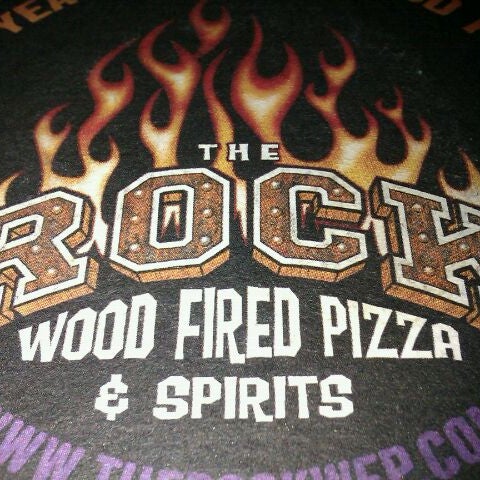 Photo taken at The Rock Wood Fired Pizza by Derek W. on 12/8/2011