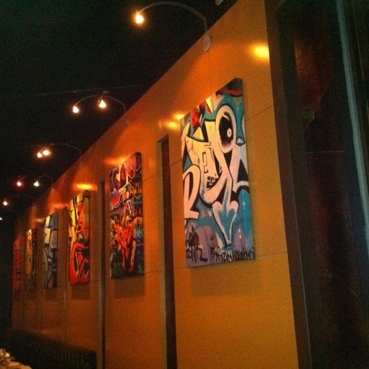 Photo taken at eighty3 food &amp; drink by Andrea Gayle on 12/29/2011